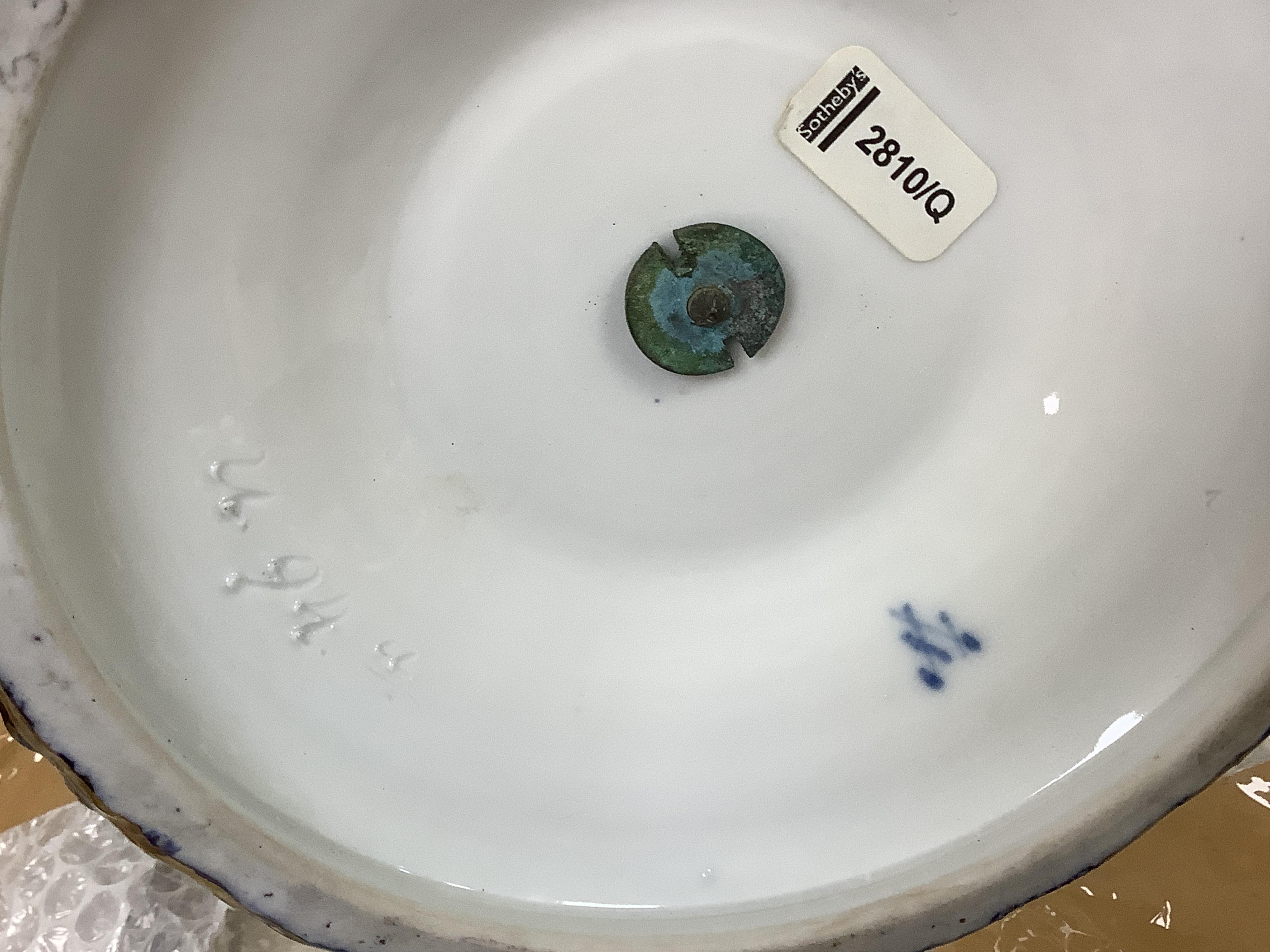 A pair of late 19th century Meissen three tier cake stands with figural tops, 48cm high